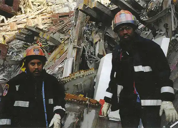 FDNY EMS medic first responder Kenneth Johnson navigating the World Trade Center debris pile looking out for crevasses and exploring voids for survivors.