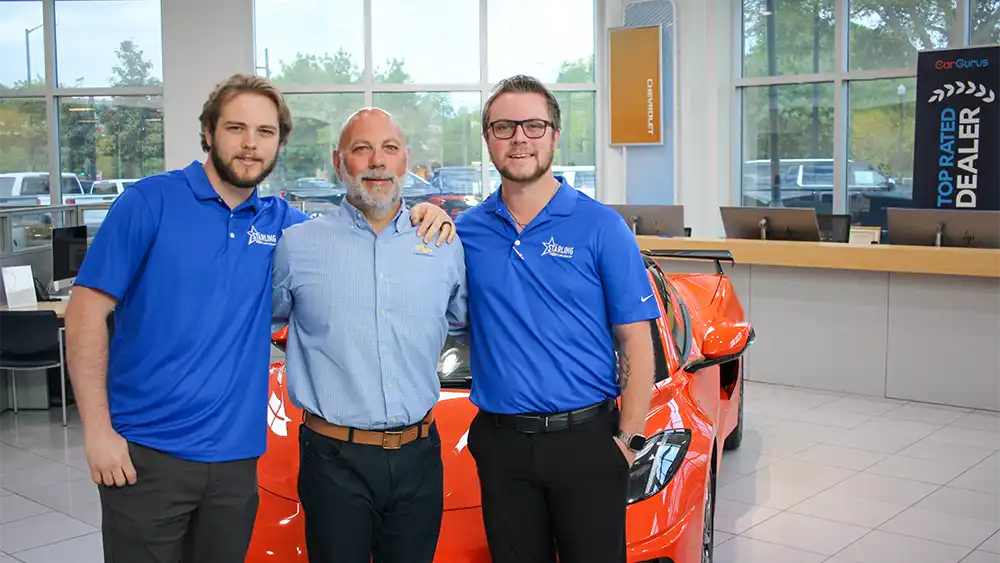 Starling Chevrolet GM Joe Sarro (center) with his sons Jarrett and Joey.